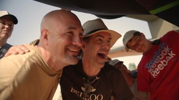 Eric Zala and the explosions expert rejoice at a successful scene.