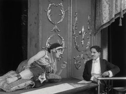 Charles Chaplin and May White in A Night in the Show (1915)