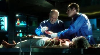 Robert David Hall, Bree Williamson, and David Berman in CSI: Crime Scene Investigation (2000)