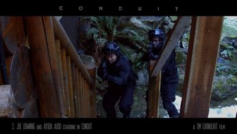 S. Joe Downing and Ayuba Audu in Conduit (2017)