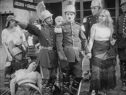 Charles Chaplin, Edna Purviance, Leo White, and May White in A Burlesque on Carmen (1915)