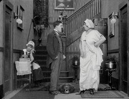 Billy Armstrong, Marta Golden, and Edna Purviance in Work (1915)