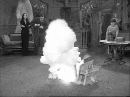 John Astin, Carolyn Jones, and Ken Weatherwax in The Addams Family (1964)