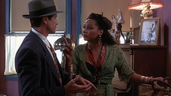 Arnetia Walker and Fred Ward in Cast a Deadly Spell (1991)