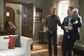 Jesse Tyler Ferguson, Eric Stonestreet, and Dana Powell in Modern Family (2009)