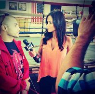 Crystal Marie Denha interviewing Vic Darchinyan for Top Rank Boxing at media day workouts.