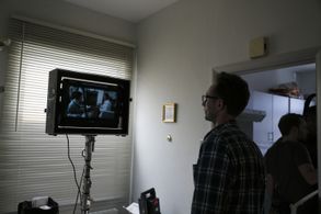 Staten watching a scene play out on This Way Out