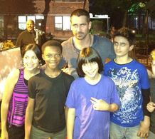 Justin with Colin Farrell and kid cast members on the set of Dead Man Down