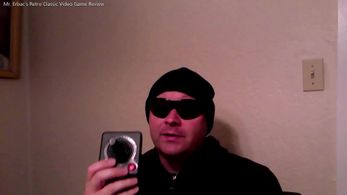 Steven as Mr. Erbac showing an Atari 2600 controller