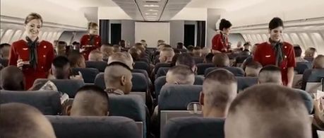 Still from Jarhead - Patricia Lauriet first flight attendant on the right, with Jake Gylenhaal , Jami Foxx, and Peter Sa
