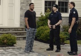 Still shot from the movie “Alarmed” (Tommy Fury as Officer Rahn. Shown in the middle.