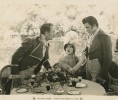 Billie Dove, Armand Kaliz, and Gilbert Roland in The Love Mart (1927)