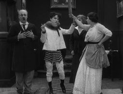 Charles Chaplin, Marta Golden, Charles Inslee, and Edna Purviance in A Woman (1915)