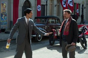 Bruce restrains an angry Mr. Morgenstern in the Vienna street (Exodus to Shanghai)