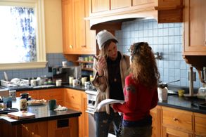 Katie Cassidy and Devin Adair on set