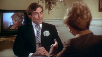 Timothy Dalton and Rona Barrett in Sextette (1977)