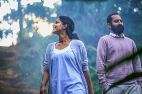 Fahadh Faasil and Aishwarya Lekshmi in Varathan (2018)
