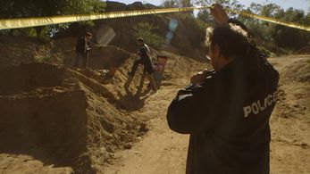 Glenn playing a Police Officer in 