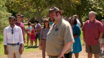 Ranger Patrick (Ben Zelevansky) supervises Pawnee Parks Department barbecue guests Tom Haverford (Aziz Ansari),Chris Tr
