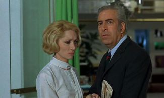 Claude Gensac and Guy Tréjan in Jo (1971)