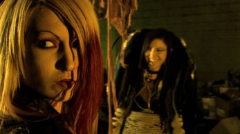 Setting up an impromptu rave, Charlie (Ashley Kay, l) has little time for Miko (Julin, r).