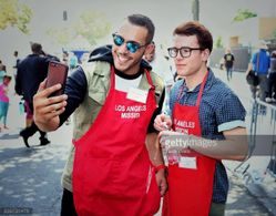 Actor Lucas Lockwood at the LA Missions Fall event with actor and artist Justin Tinucci.