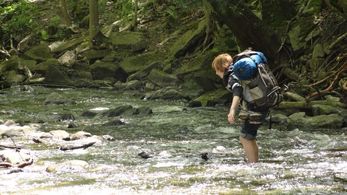 Crossing river on set of Never Go Back