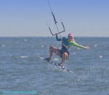 Kitegirl Kiteboarder Sabrina A. Parisi during a kitesurfing session at Flysurfer Kiteboarding