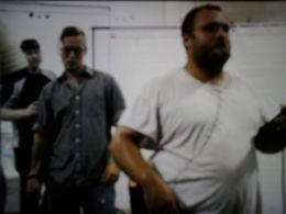 Steven in the background behind Lane Blanton and Zachary Moose as part of the crew for short film, The Snag (2019)