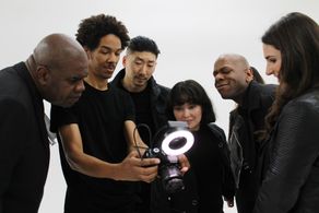 Still of Nate Lyles on set of a photo shoot for Star Kids