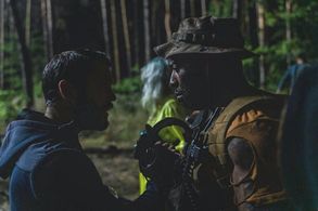 Mark Ebulué taking notes and some direction (as Fixit in Ghost Recon Breakpoint)