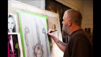 Renowned comic book artist, Tony Harris, paints Lily Keene's likeness on The World Is Big And Scary poster