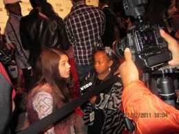 Bryce Hitchcock being interviewed on the red carpet by Vibe Magazine at Artists for Peace Organization's 