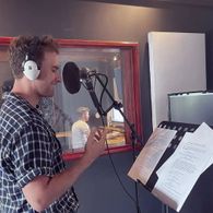 Potter performing voice over work at Outre Studios for the Price Check Black Friday Commercial