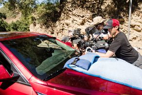 Palmer shoots Bradley Cooper on Hit & Run