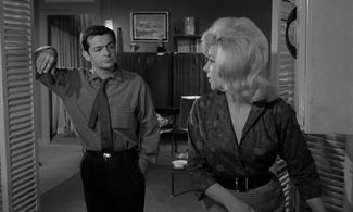 Monique Hennessy and Serge Reggiani in Le Doulos (1962)