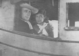 Helen Chapman and Dave O'Brien in Outlaw Roundup (1944)