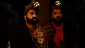 Rishab Shetty and Pramod Shetty in Kantara (2022)
