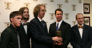 Presenters Jesse McCartney and Matthew Gray Gubler congratulate Best TV Production winners Kit Boss, Kenny Micka and Ben