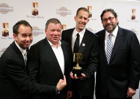 Animated feature winners Jonas Rivera, Pete Docter, and Bob Peterson with presenter (and event host) William Shatner