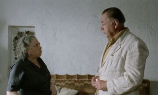 Linda Moretti and Philippe Noiret in The Postman (1994)