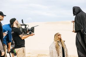 Anthony Littlechild frames up the shot with Tones and I on 