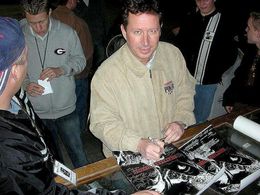 Leo Daniels signing posters for fans.