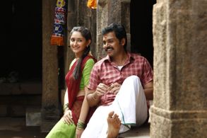 Karthi and Sayyeshaa Saigal in Kadaikutty Singam (2018)