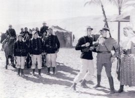 John Wayne, Hooper Atchley, Francis X. Bushman Jr., Gordon De Main, Raymond Hatton, and Jack Mulhall in The Three Musket