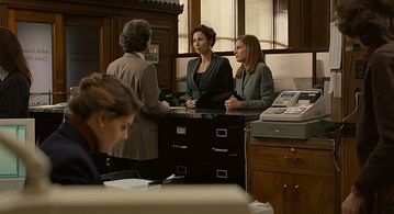 Eddie Huchro as the Courthouse Clerk in Conviction with Hilary Swank and Minnie Driver