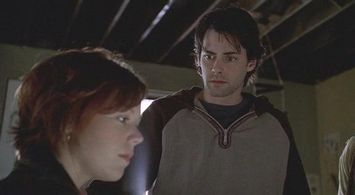 Emily Bergl and Adam Kaufman in Taken (2002)