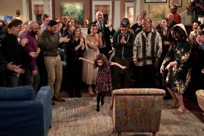 Taking center stage, Ella Grace Helton dances while surrounded by the cast, crew and production as they celebrate wrappi