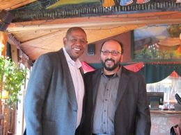 Still of Kevin Mukherji and Forest Whitaker.