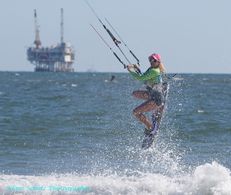 Kitegirl Kiteboarder Sabrina A. Parisi during a kitesurfing session at Flysurfer Kiteboarding